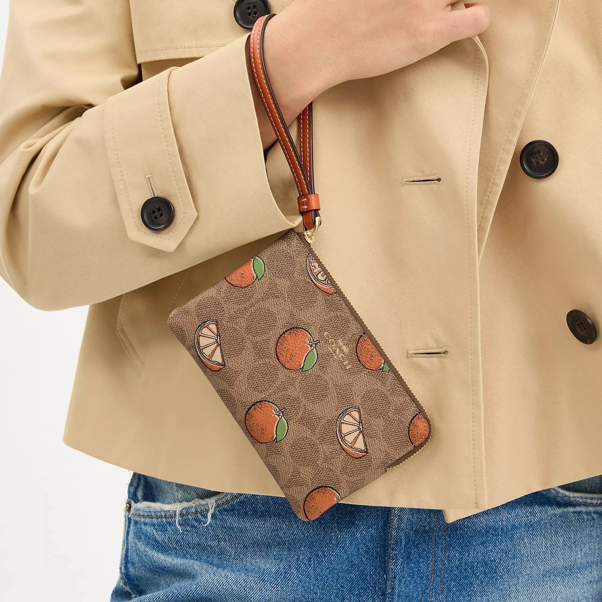 Coach Outlet Corner Zip Wristlet In Signature Canvas With Orange Print