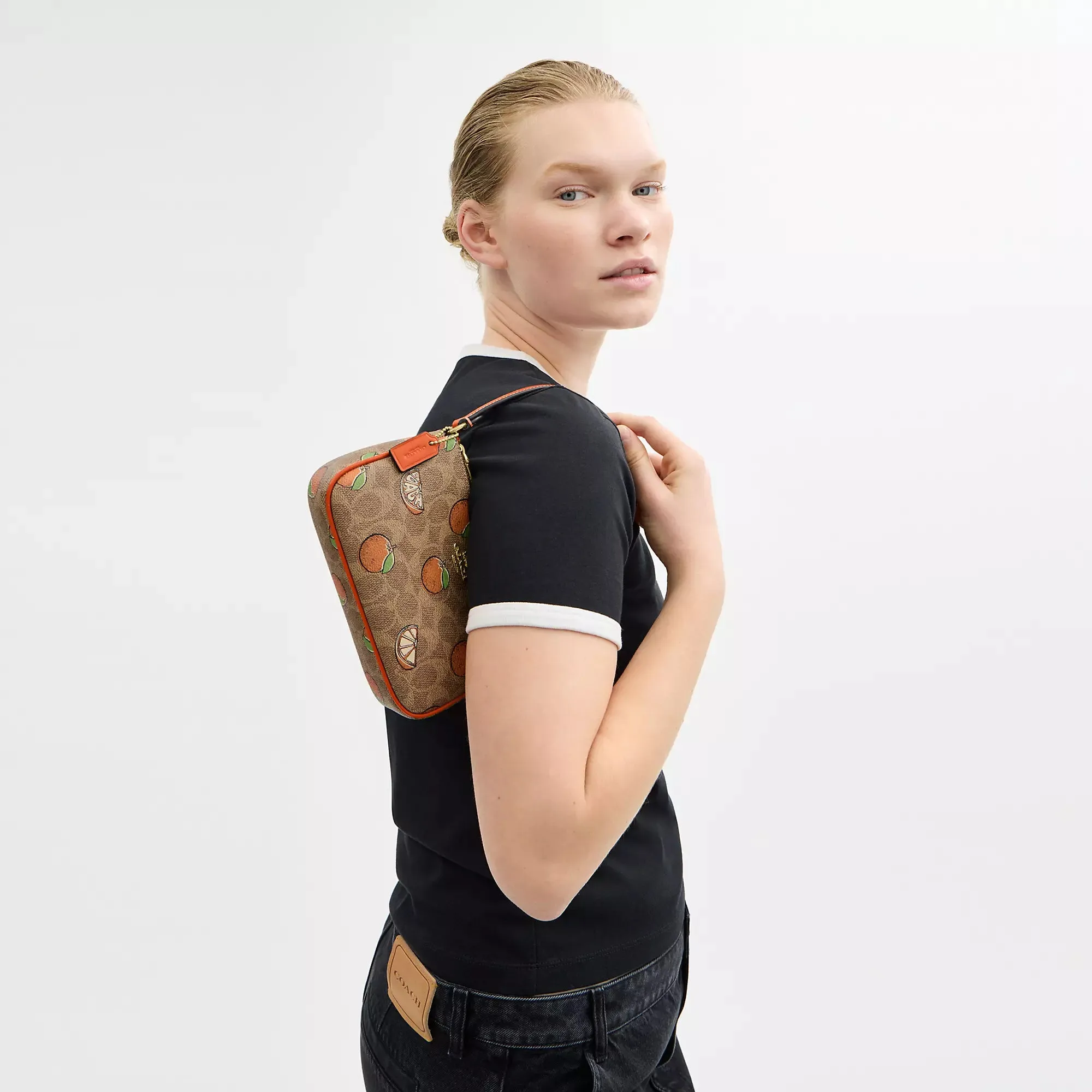 Coach Outlet Nolita 19 In Signature Canvas With Orange Print